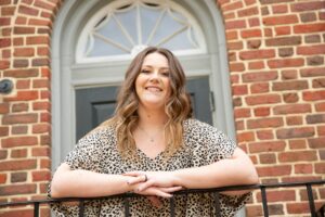 a woman leaning on a railing