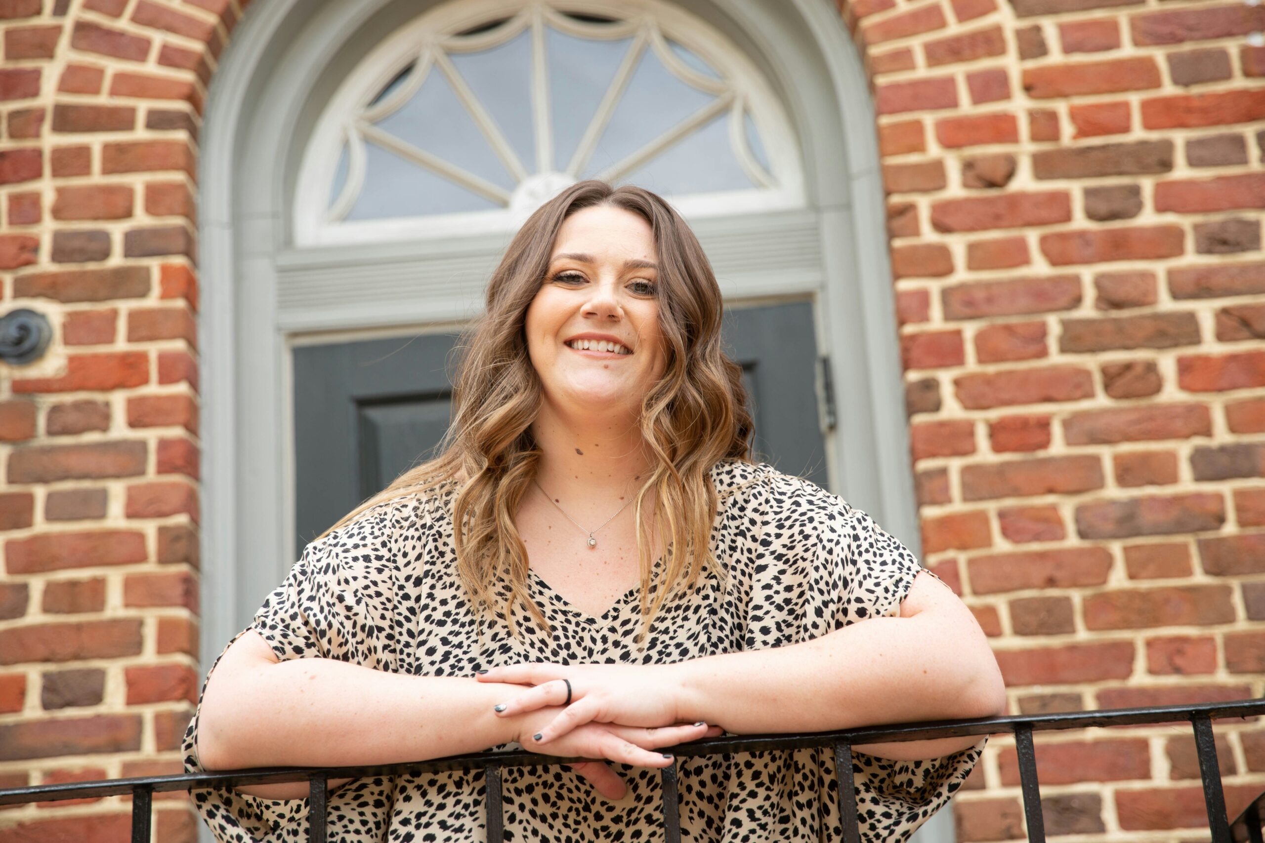 a woman leaning on a railing